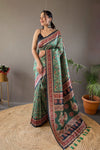 Green Digital Print Semi Silk Saree with Soft Weaves, Elegant Pallu & Border, Tassels, and Unstitched Blouse Piece.