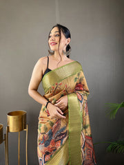 Pure Green Tussar Silk Saree with Handpainted Kalamkari Print, Contrast Zari Weaving Border, Zari Woven Pallu, and Coordinated Contrast Printed Blouse.