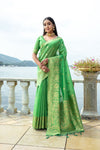 Premium Green Soft Silk Saree with Fine Zari Weaving Border, Butti Design, and Rich Zari Pallu.