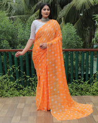 Elegant Orange Moss Chiffon Saree with Foil Print – Perfect for Festivals and Weddings | Imported Silk Blouse Included.