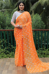 Elegant Orange Moss Chiffon Saree with Foil Print – Perfect for Festivals and Weddings | Imported Silk Blouse Included.