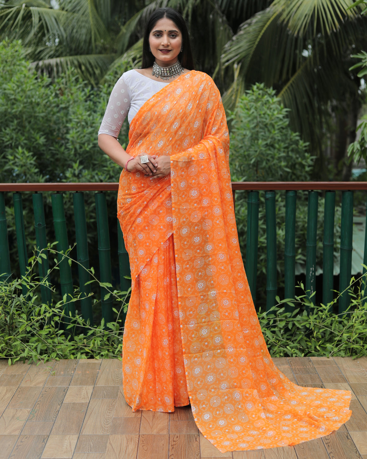 Elegant Orange Moss Chiffon Saree with Foil Print – Perfect for Festivals and Weddings | Imported Silk Blouse Included.