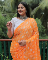 Elegant Orange Moss Chiffon Saree with Foil Print – Perfect for Festivals and Weddings | Imported Silk Blouse Included.