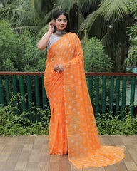 Elegant Orange Moss Chiffon Saree with Foil Print – Perfect for Festivals and Weddings | Imported Silk Blouse Included.