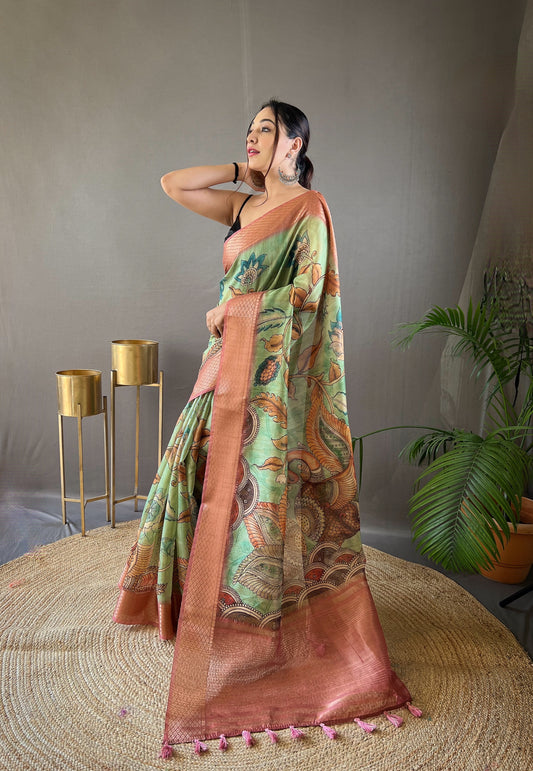 Pure Pink Tussar Silk Saree with Elegant Handpainted Kalamkari Print, Contrast Zari Weaving Border, and Zari Woven Pallu - Paired with Contrast Printed Blouse.