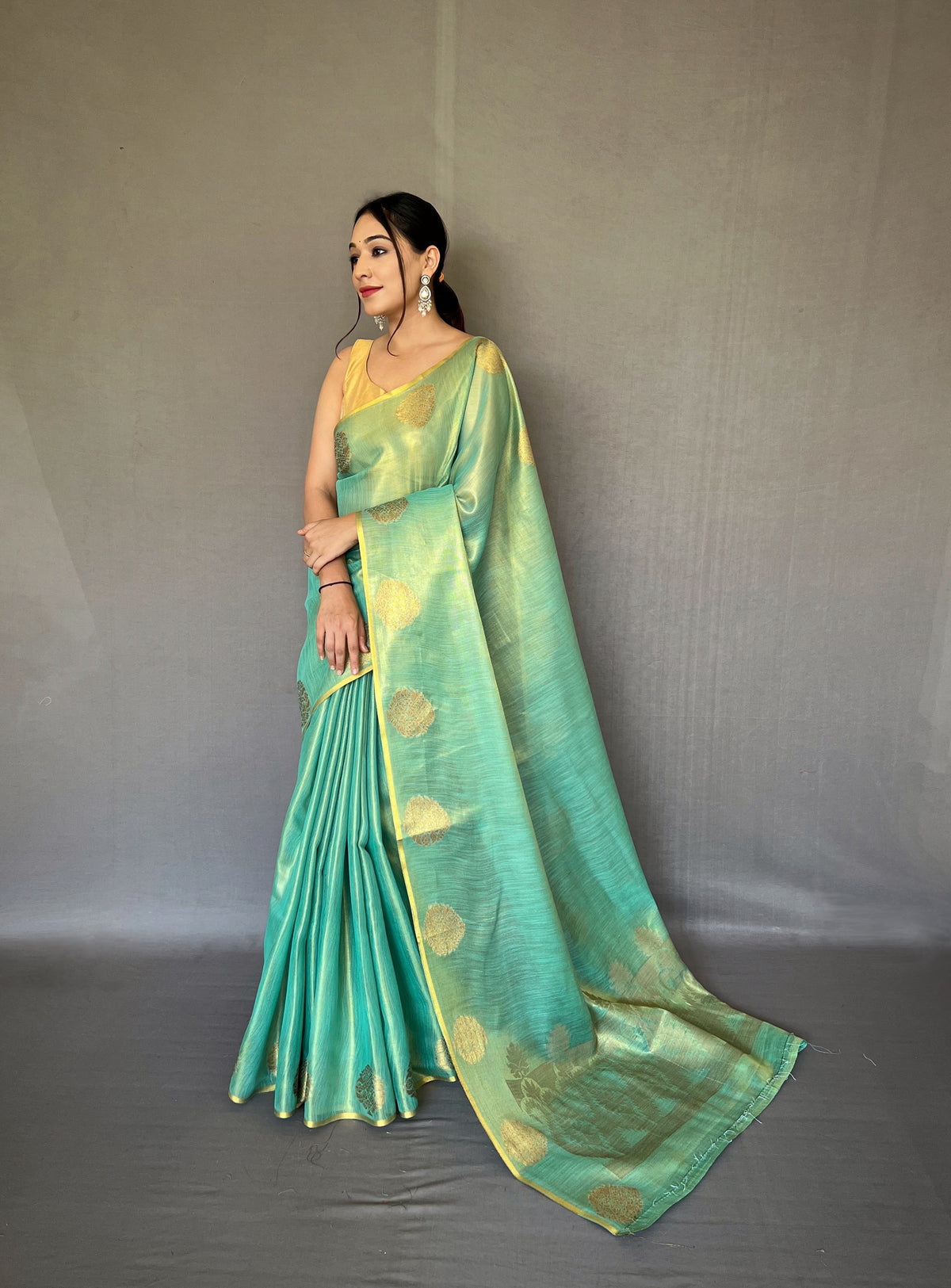 "Elegant Sea Green Tissue Silk Saree with Jacquard Zari Weaving - Rich Pallu, Jacquard Weaving Border, and Beautiful Motifs | 6.3 Meter Length with Blouse.