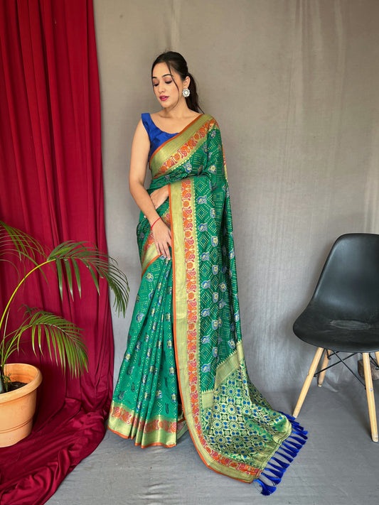 Pure Green Kachii Patola Silk Saree with All-Over Patola Weaving, Meenakari Border, Rich Pallu & Tassels with Unstitched Blouse Piece.