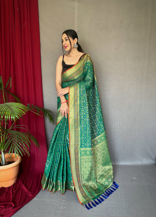 Green Color Pure Patola Silk Saree with Patola Fusion Design, Contrast Meenakari Work, Rich Pallu with Tassels – Includes Unstitched Blouse Piece