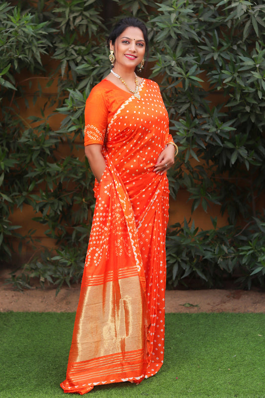 Premium Orange Pure Bandhej Silk Saree with Lagdi Patta Zari Weaving & Rich Pallu | Includes Bandhej Design Blouse.