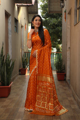 Exquisite Orange Bandhej Silk Saree with Checks Pattern Pallu – Luxurious Handmade Design and Matching Bandhej Blouse.