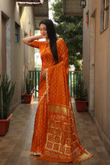 Exquisite Orange Bandhej Silk Saree with Checks Pattern Pallu – Luxurious Handmade Design and Matching Bandhej Blouse.