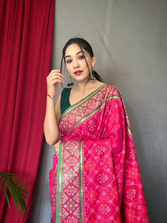 Pink Color Soft Rangeen Patola Silk Saree with All-Over Meenakari Weaving, Rich Pallu, and Tassels – Includes Unstitched Blouse Piece.