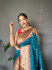 Rama Color Pure Paithani Silk Saree with Rich Woven Pallu, Tassels, and Unique Motif Pattern – Includes Unstitched Blouse Piece.