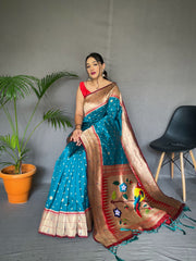 Rama Color Pure Paithani Silk Saree with Rich Woven Pallu, Tassels, and Unique Motif Pattern – Includes Unstitched Blouse Piece.