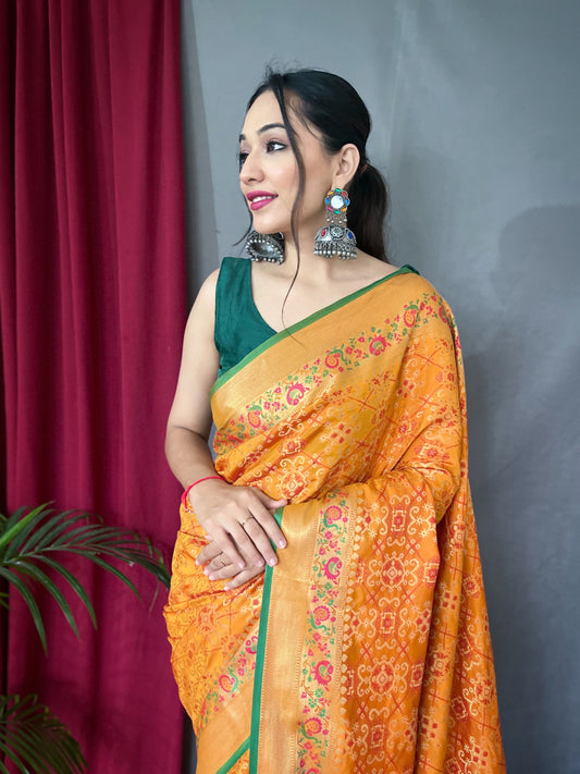 Luxurious Yellow Patola Silk Saree with Paithani Fusion – All-Over Contrast Patola Weave with Meenakari Detailing and Rich Pallu with Tassels.