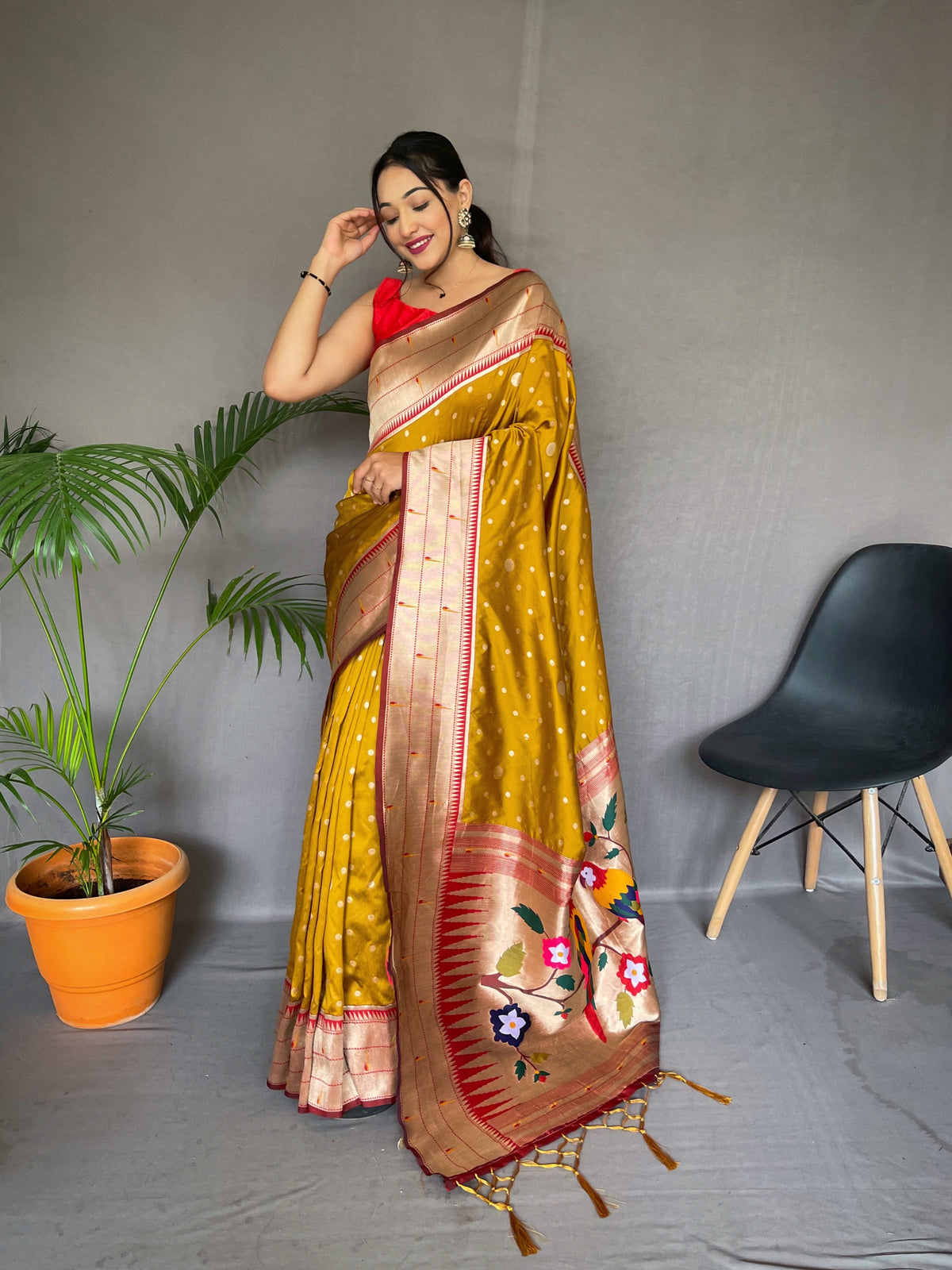 Yellow Color Pure Paithani Silk Saree with Rich Woven Pallu, Tassels, and Unique Motif Pattern – Includes Unstitched Blouse Piece.