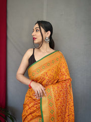 Yellow Color Pure Patola Silk Saree with Patola Fusion Design, Contrast Meenakari Work, Rich Pallu with Tassels – Includes Unstitched Blouse Piece.