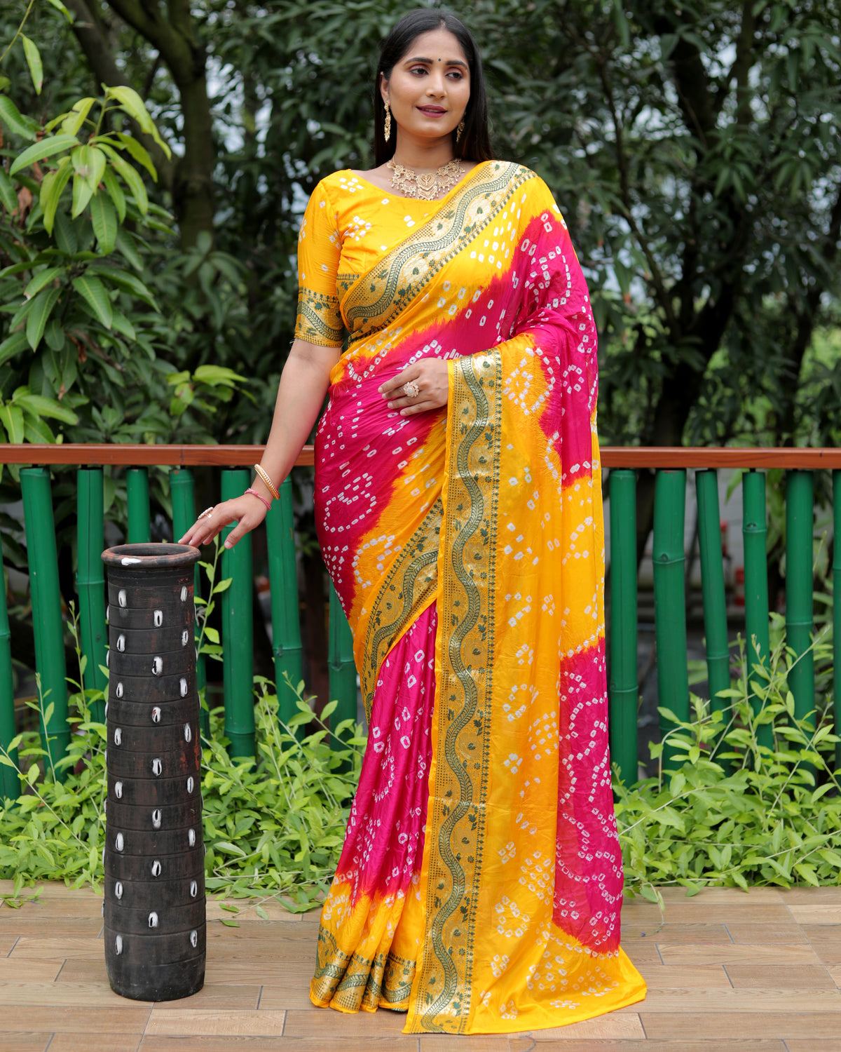 Luxurious Yellow Dual Colour Bandhej Silk Saree with Zari Weaving and Broad Border – Soft, Lightweight, and Stylish.